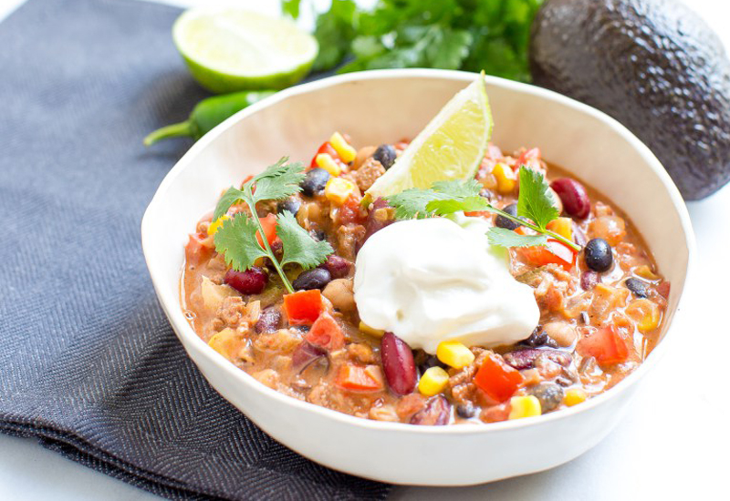 Chili in a Bowl with Sour Cream and a Lime Slice