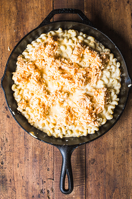 Macaroni and cheese ready to be cooked in cast iron skillet