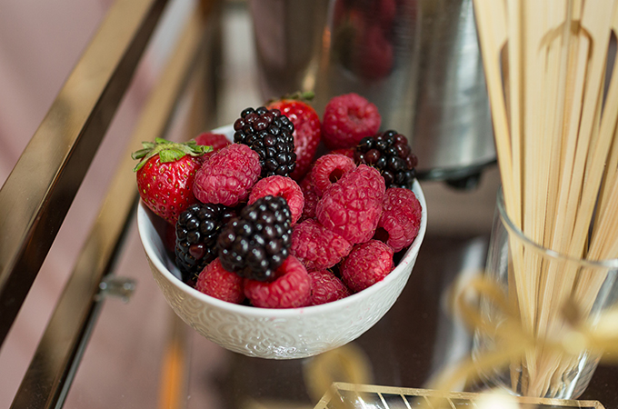 Strawberries, blackberries and raspberries in a white bowl