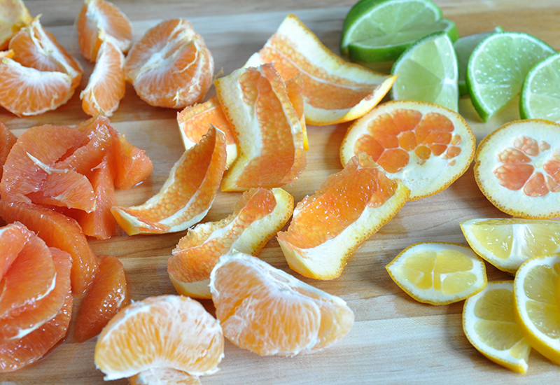 Sliced and segmented oranges, lemons and limes