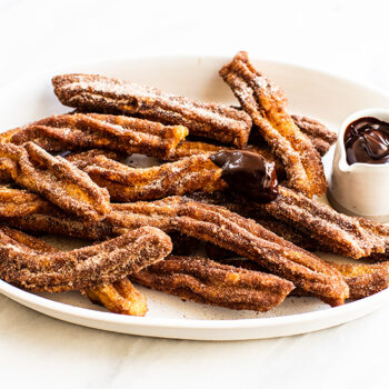 Churros on a Plate with Chocolate Dipping Sauce