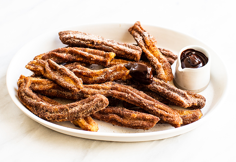 Churros on a Plate with Chocolate Dipping Sauce