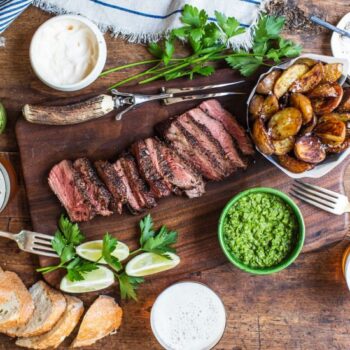 Steak with sides on a cutting board