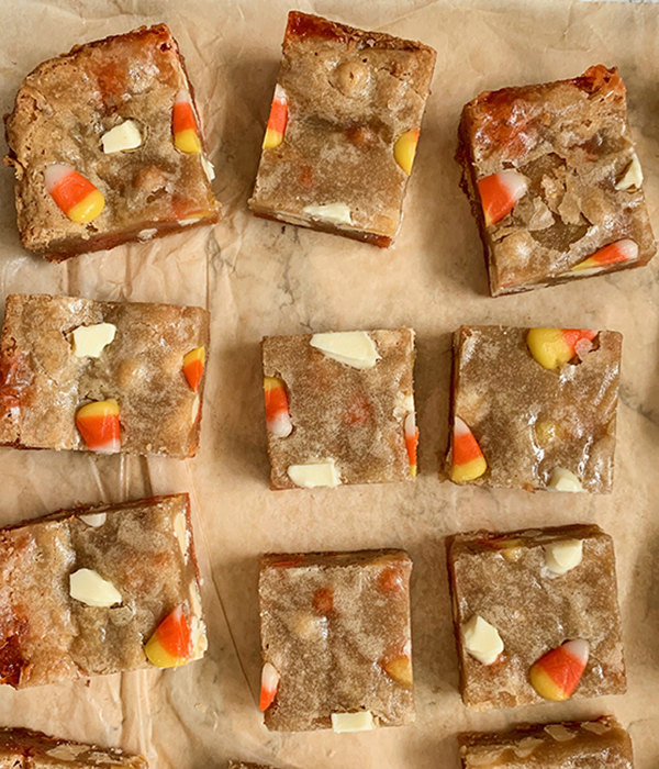 Candy Corn White Chocolate Blondies on Parchment Paper