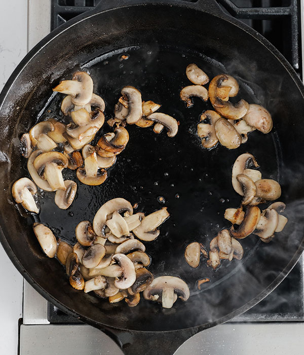 Mushrooms Browning in Cast-Iron Skillet