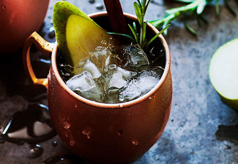 PEar moscow mule served in copper mug