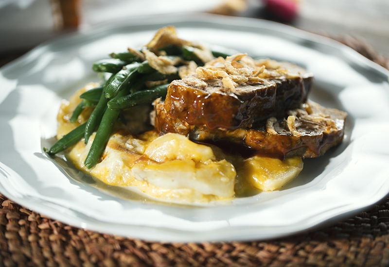 Turkey meatloaf served with green beans and potatoes