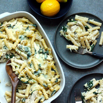 Creamy lemon chicken baked ziti in baking dish and served on plates