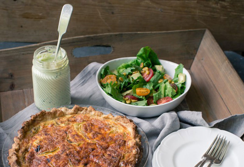 Hatch chile quiche with salad and dressing