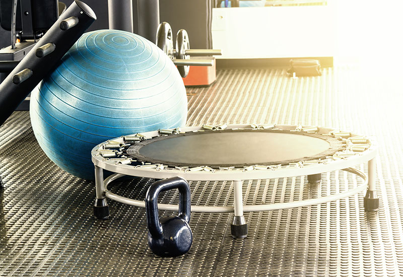 Rebounder trampoline with kettlebell and exercise ball