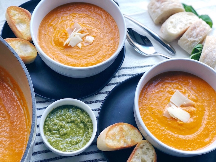Tomato soup with pesto in bowls