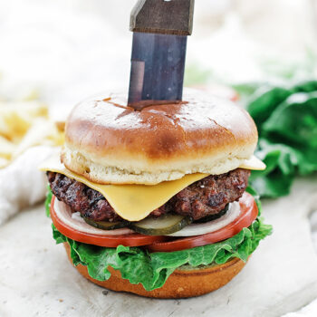 Perfect burger with knife in it
