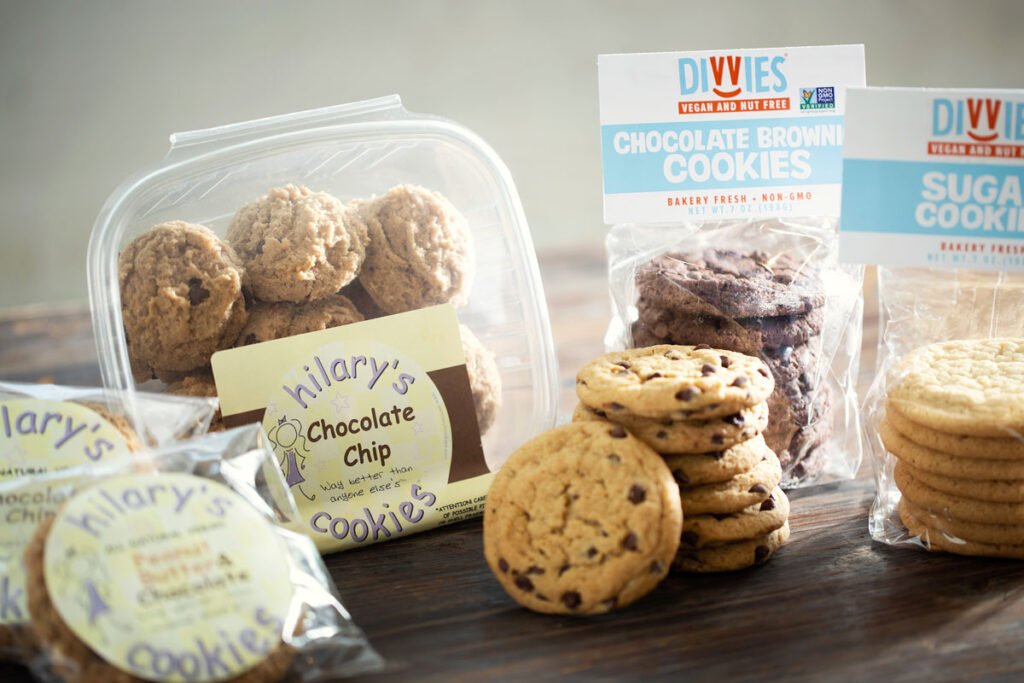 Assortment of vegan snacks available at Heinen's including Hilary's chocolate chip cookies and Divvies cookies