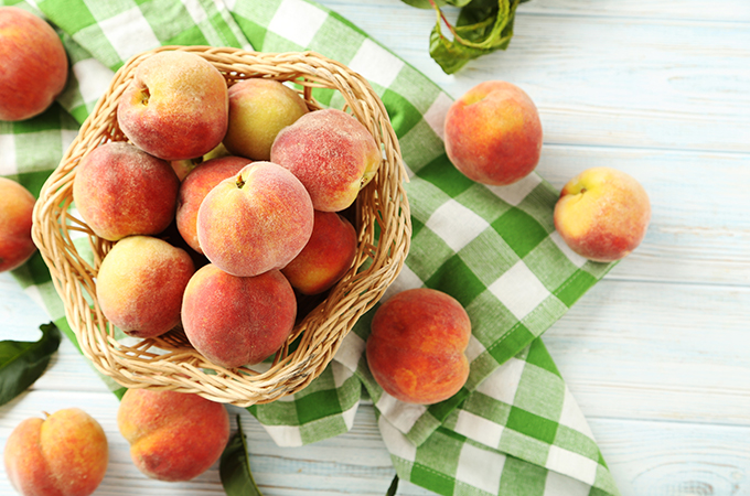 Fresh Peaches in a Basket