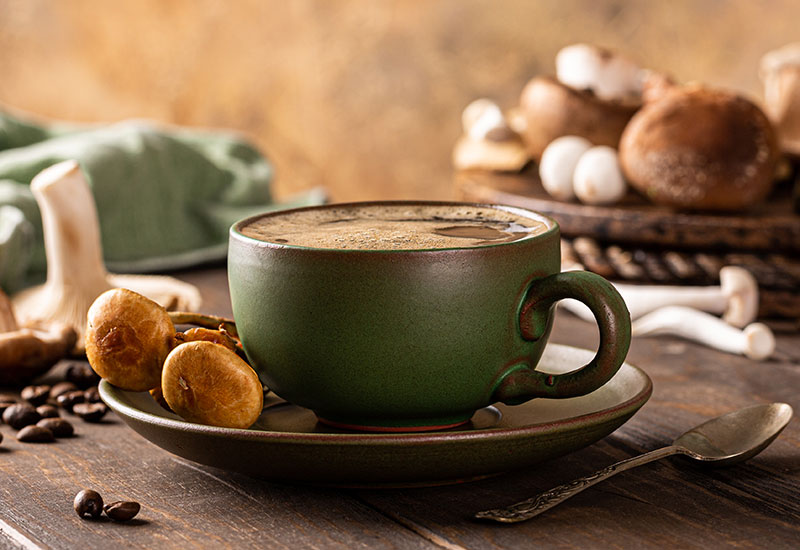 Cup of Coffee with Fresh Mushrooms and Mushroom Powder