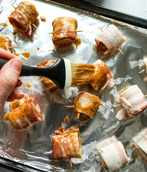 Bacon-Wrapped Christmas Ale Beer Brats with Sweet and Spicy Glaze