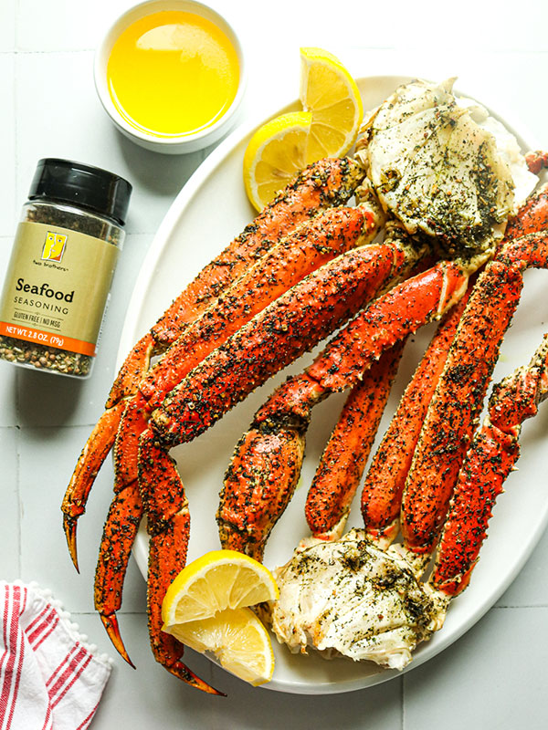 Baked Crab Leg Clusters on a Plate with Heinen's Seafood Seasoning