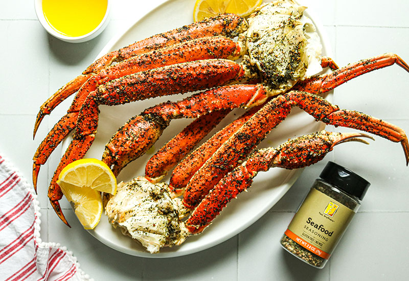 Baked Crab Leg Clusters on a Plate with Heinen's Seafood Seasoning