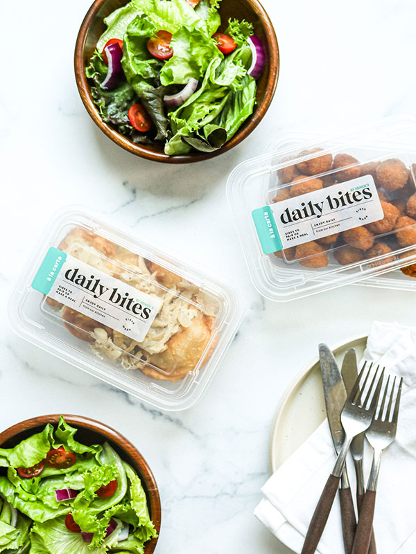 Heinen's Daily Bites Pierogies, Sauerkraut Balls and Salad in their Packaging