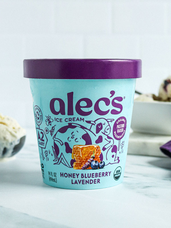 Alec's Honey Blueberry Lavender Ice Cream Beside a Bowl with Fresh Scooped Ice ream