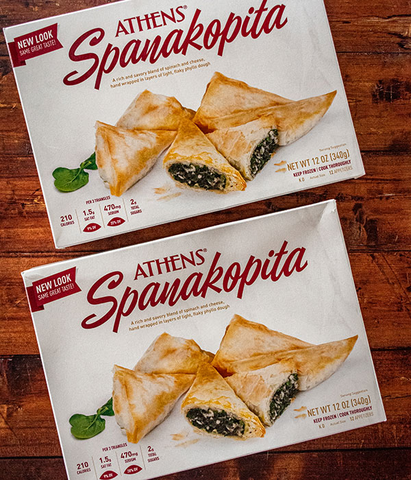 Athens Foods Frozen Spanakopita Boxes on a Wood Surface