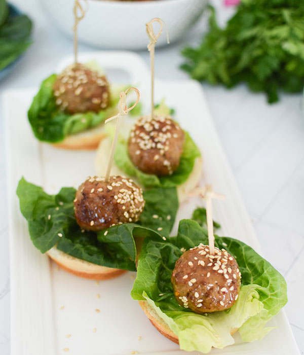 Sweet Chili Meatballs on Ciabatta Buns with Lettuce and Sesame Seeds