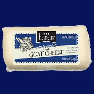 Heinen's Hand-Selected Fresh Goat Cheese Log in Its Packaging on a Dark Blue Background