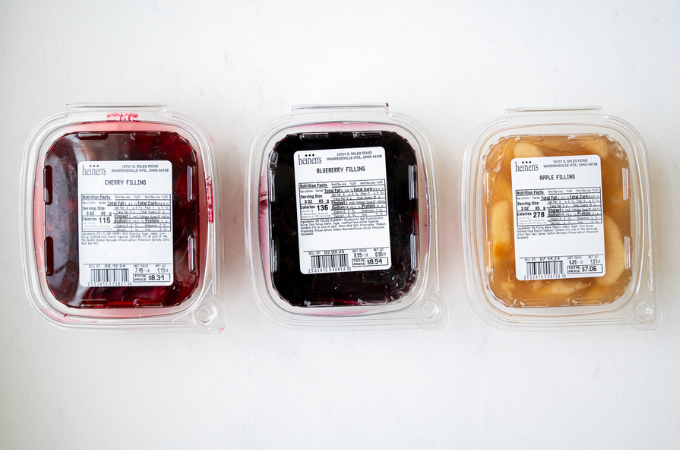 Cherry, Blueberry, and Apple Pie Filling in their containers. 
