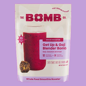 A Bag of The Bomb Co. Goji, Coconut and Acai Blender Bombs on a Lavender Background
